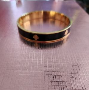 Authentic Kate Spade bangle complete with bag.